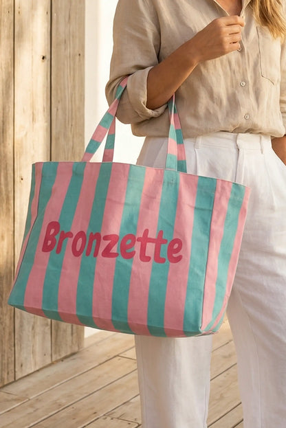 Bolsa de tela grande rayas rosa y verde menta ideal para playa o piscina, con texto Bronzette.