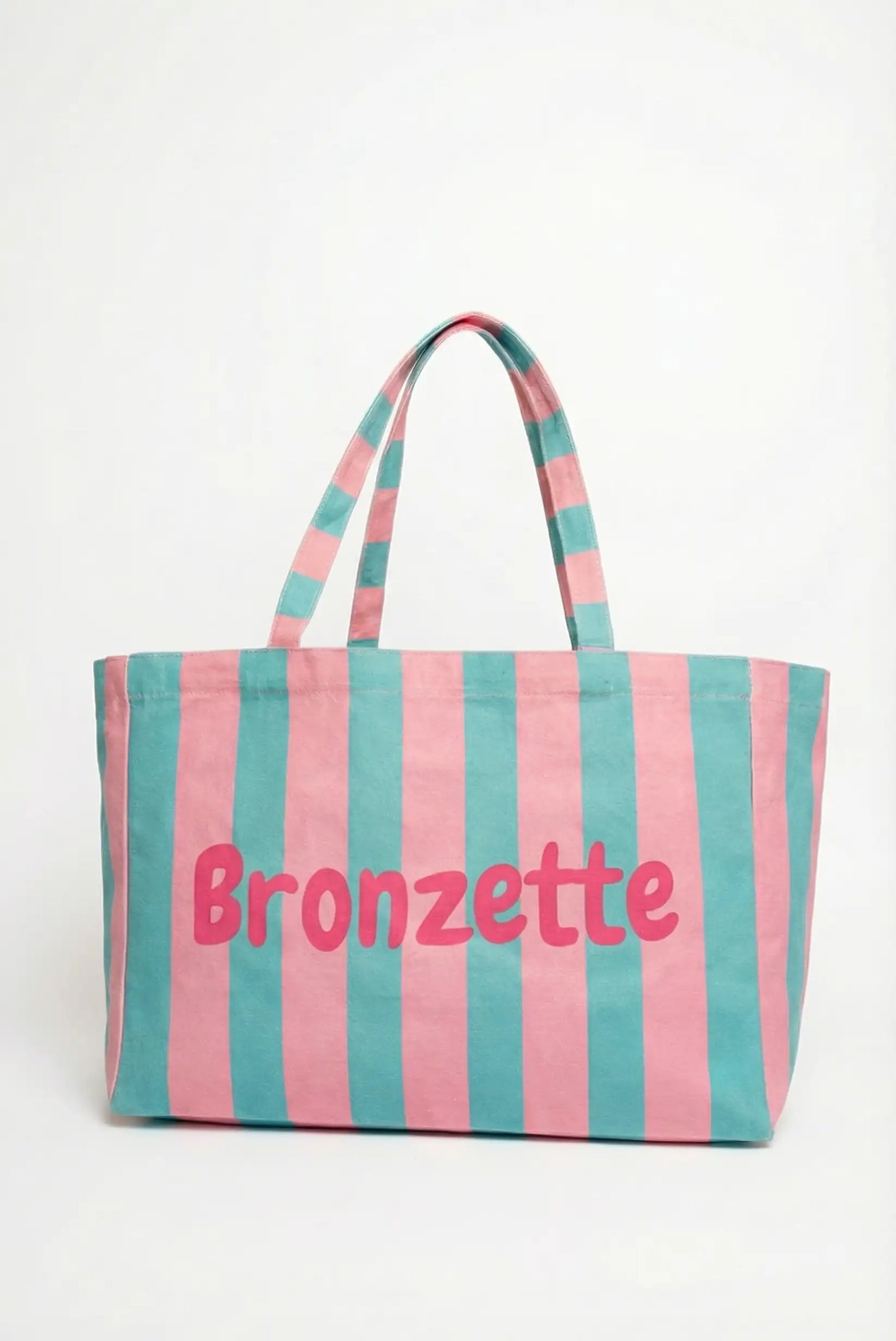 Bolsa de tela grande con rayas rosas y verdes, palabra 'Bronzette' en el centro, ideal playa o piscina