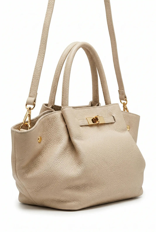 Bolso grande beige tipo Hermès de piel con asas dobles y correa larga, detalles dorados.