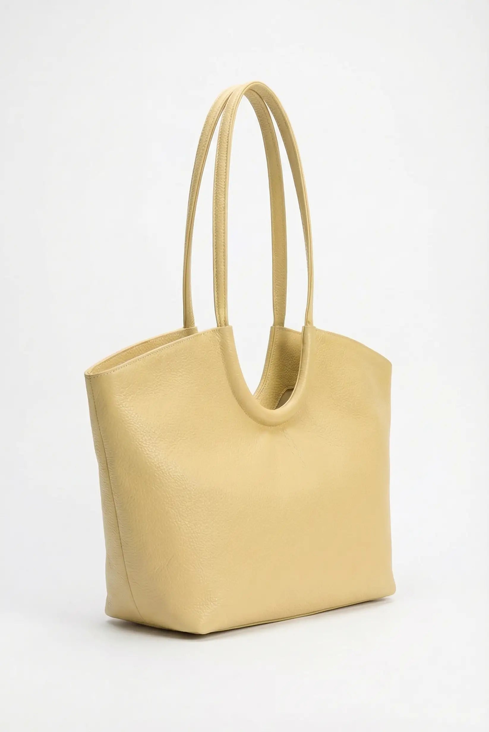 Bolso de mano grande amarillo pastel para mujer, estilo casual y moderno, fondo blanco