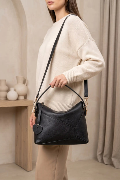 Bolso de mano y bandolera Puzzle de piel negra con detalle de corazón de CHICA del Sur