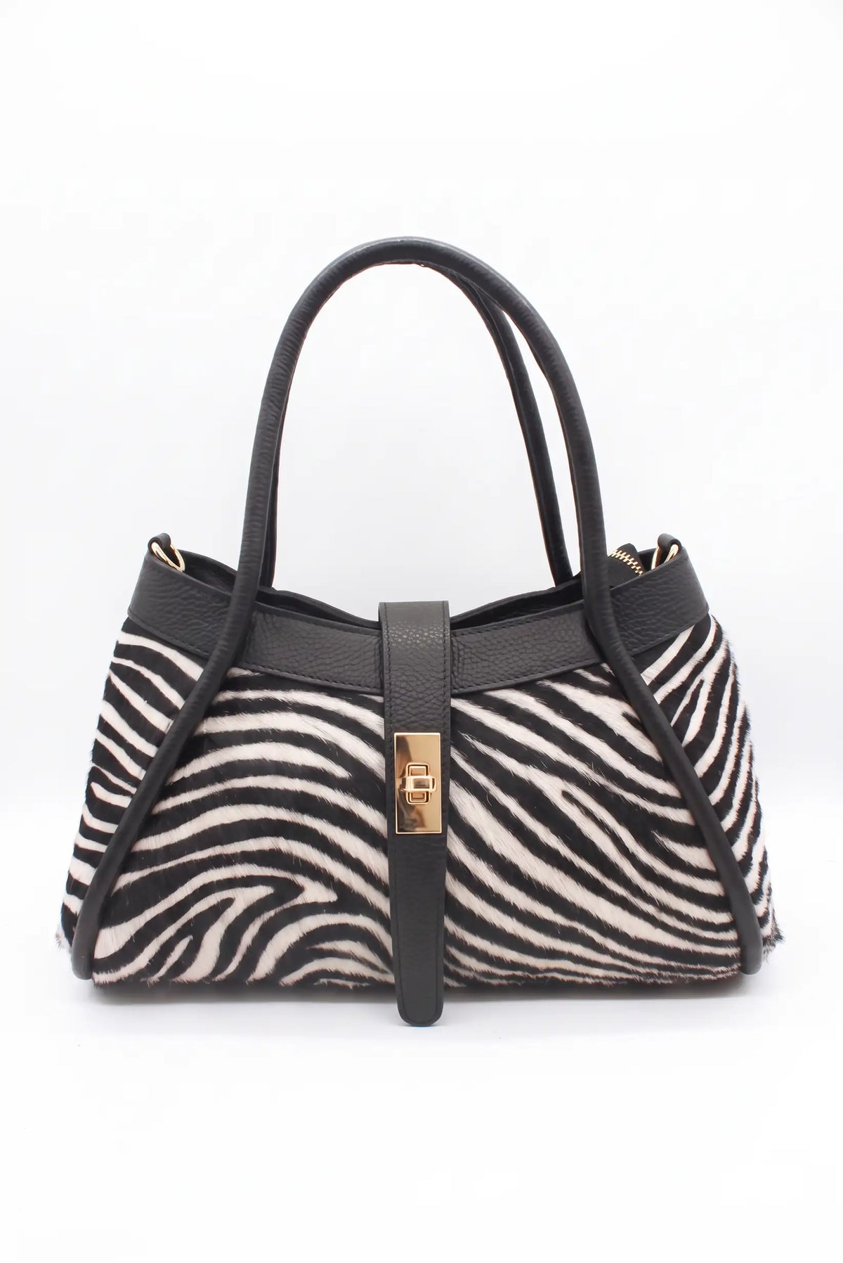 Bolso de mujer CHICA del Sur con estampado de cebra en pelo de potro y detalles negros.