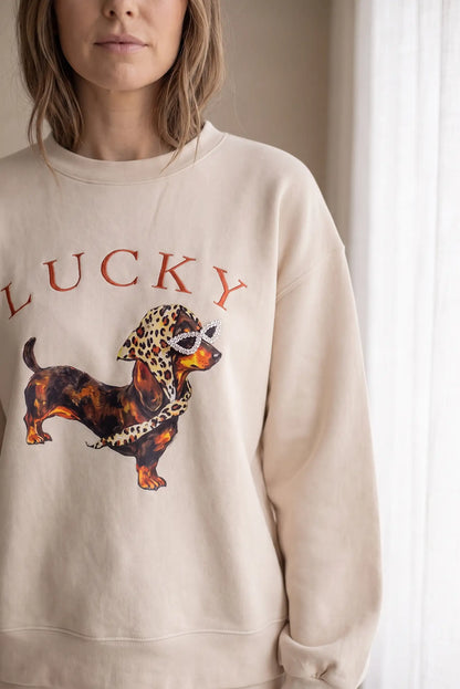 Sudadera beige de mujer CHICA del Sur con estampado de perro Lucky y detalles de pedrería.