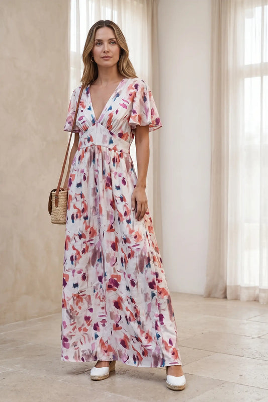 Vestido largo estampado floral con cuello en V y mangas cortas, ideal para looks casuales y estilosos