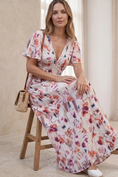 Vestido largo estampado floral con cuello en V y mangas cortas, ideal para looks casuales y estilosos