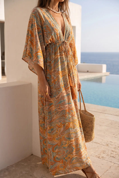 Vestido largo estampado boho con cuello en V y mangas amplias, ideal para playa y verano